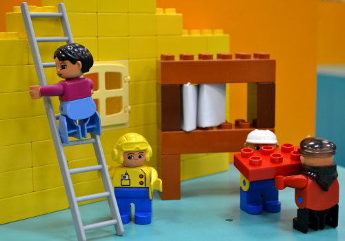 Lego figurines working on a Lego construction site